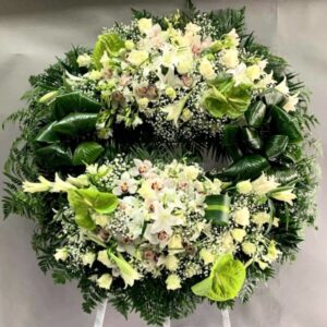 Wheel-Shaped Funeral Wreath with Two Floral Arrangements